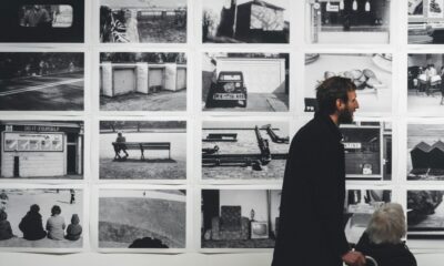 Arts professionals viewing an exhibition in a gallery