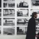 Arts professionals viewing an exhibition in a gallery