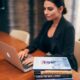 Editor working on a laptop in a professional publishing and journalism workspace