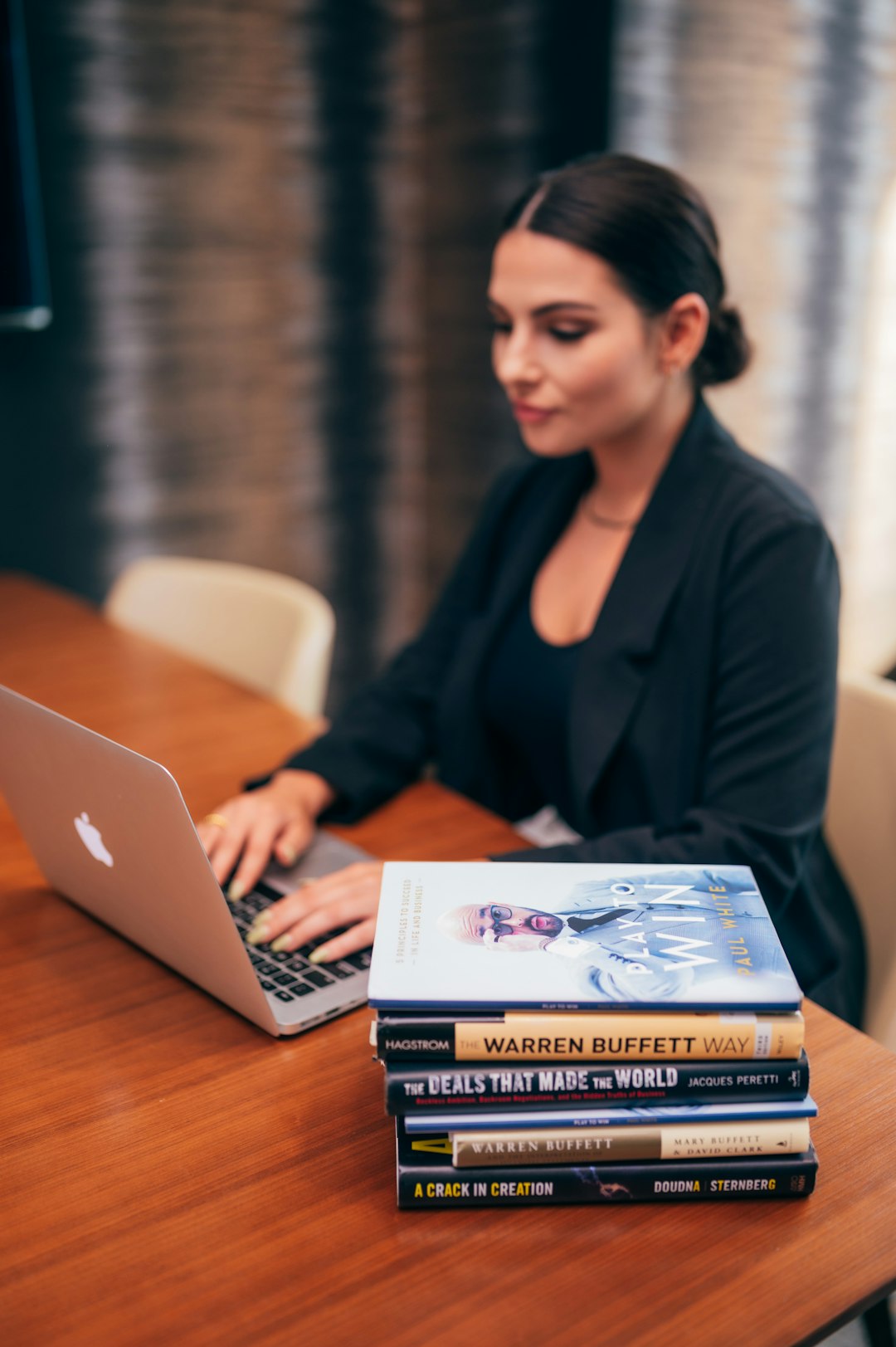 Editor working on a laptop in a professional publishing and journalism workspace