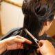 Hair stylist working with a client in a professional salon