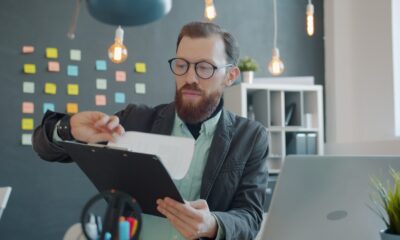 Job seeker reviewing documents and a job description at a desk