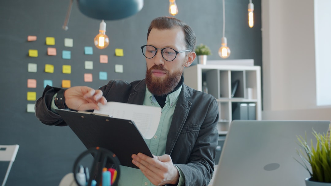 Job seeker reviewing documents and a job description at a desk