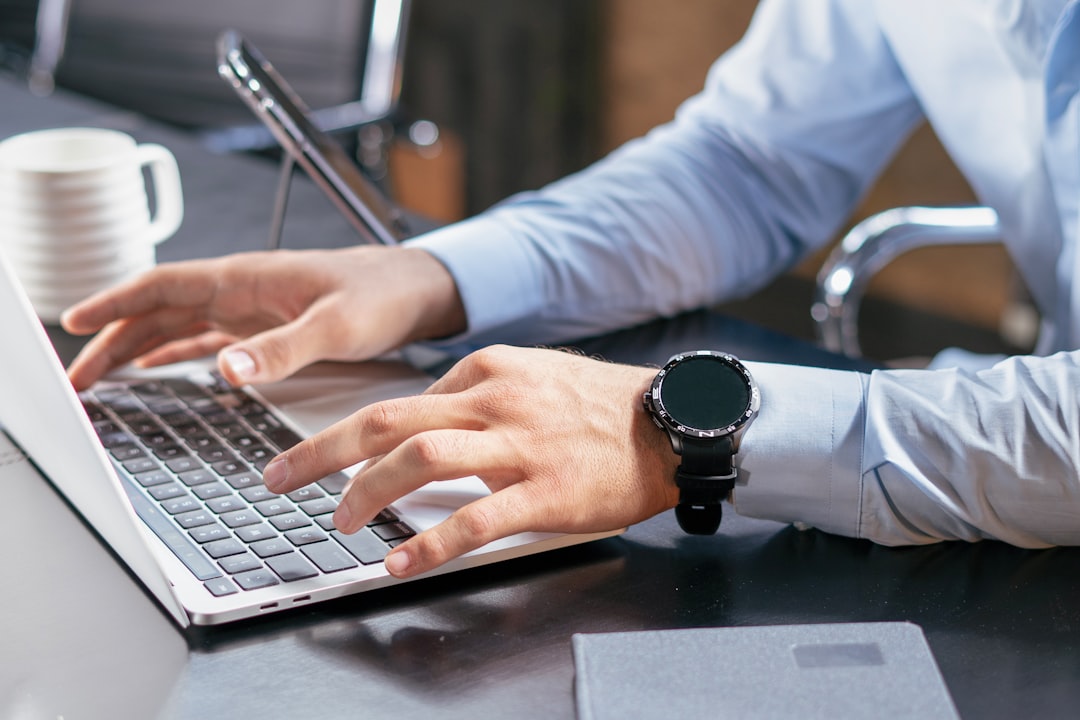 Person using a laptop to research transferable skills for a new career