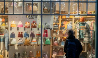 Retail worker helping a customer in a modern store in the UK