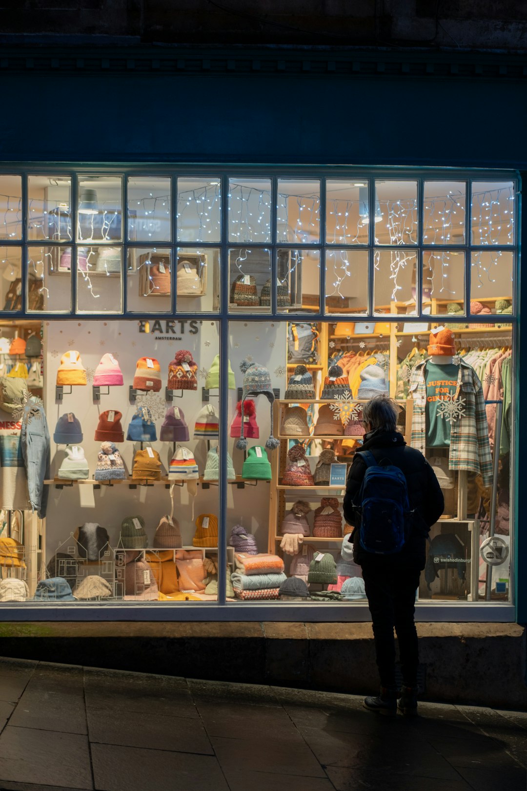 Retail worker helping a customer in a modern store in the UK