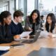 Students and graduates discussing UK internship opportunities in a modern workplace