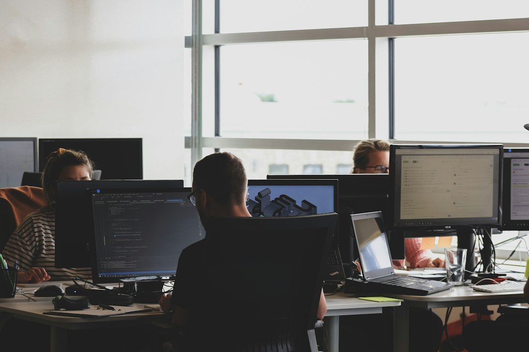Technology professionals working at computers