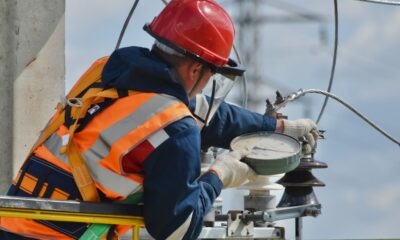 Telecommunications engineer working with network equipment and cables