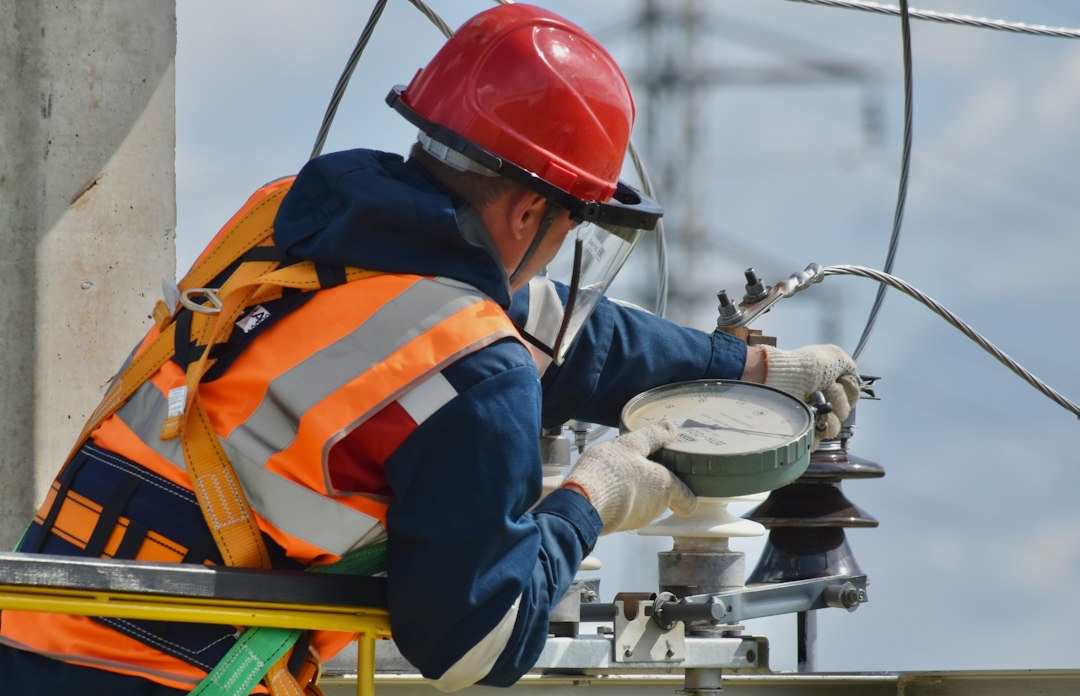 Telecommunications engineer working with network equipment and cables